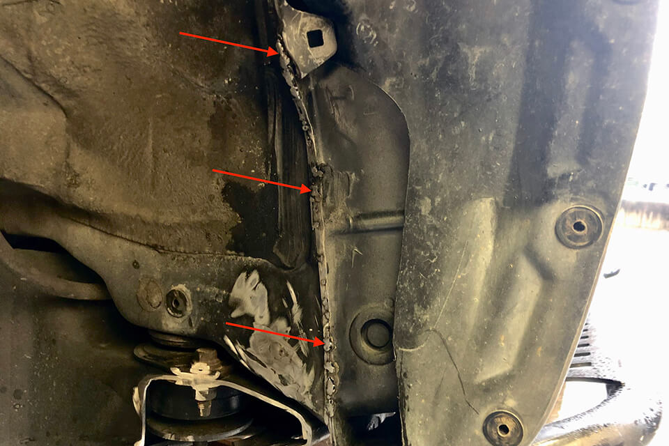 Using a 19mm socket, remove the bolt attaching the sway bar end link to the lower control arm. Do this on both sides so that the sway bar is free to rotate up and out of the way of the lower control arm.